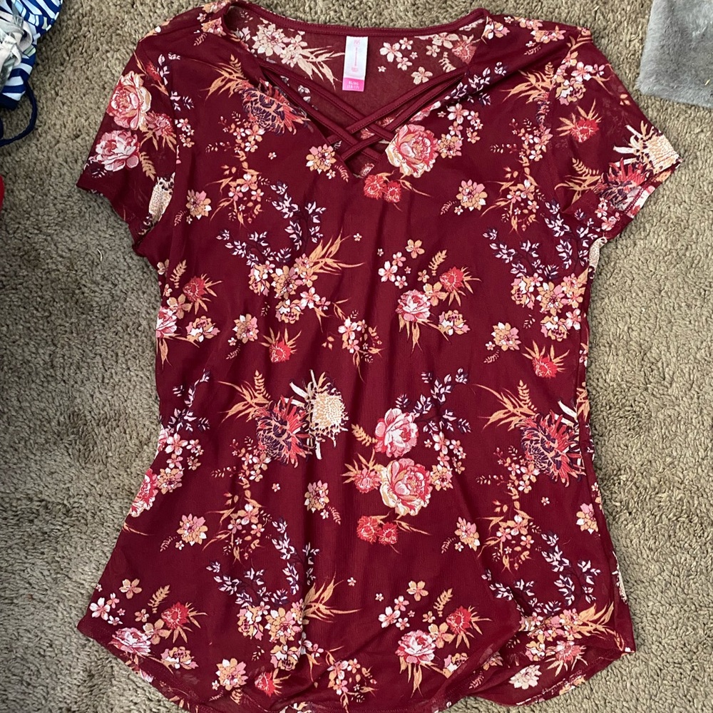 Red, floral blouse with a lace-up front